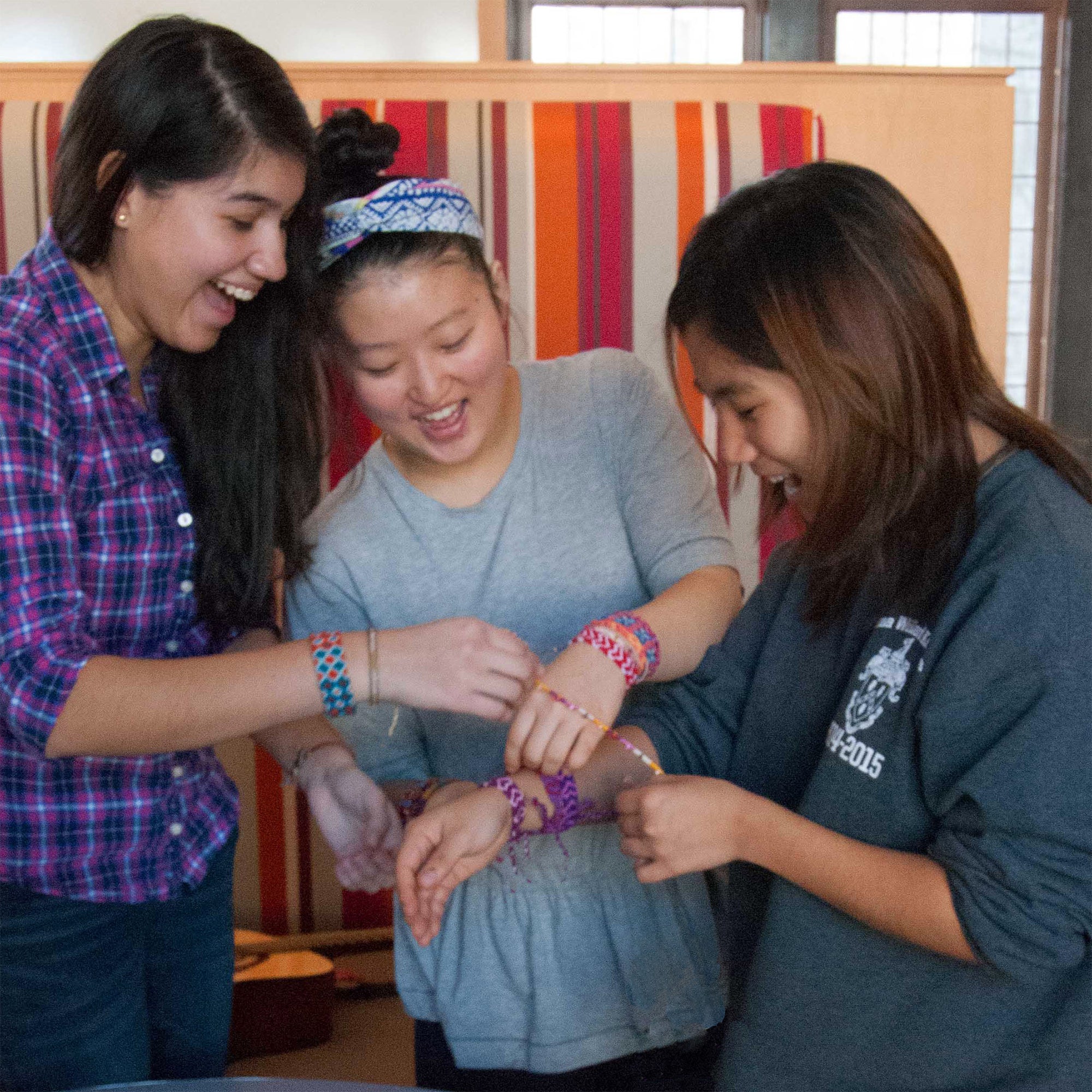 Girls with Friendship Bracelets - Mayan Hands