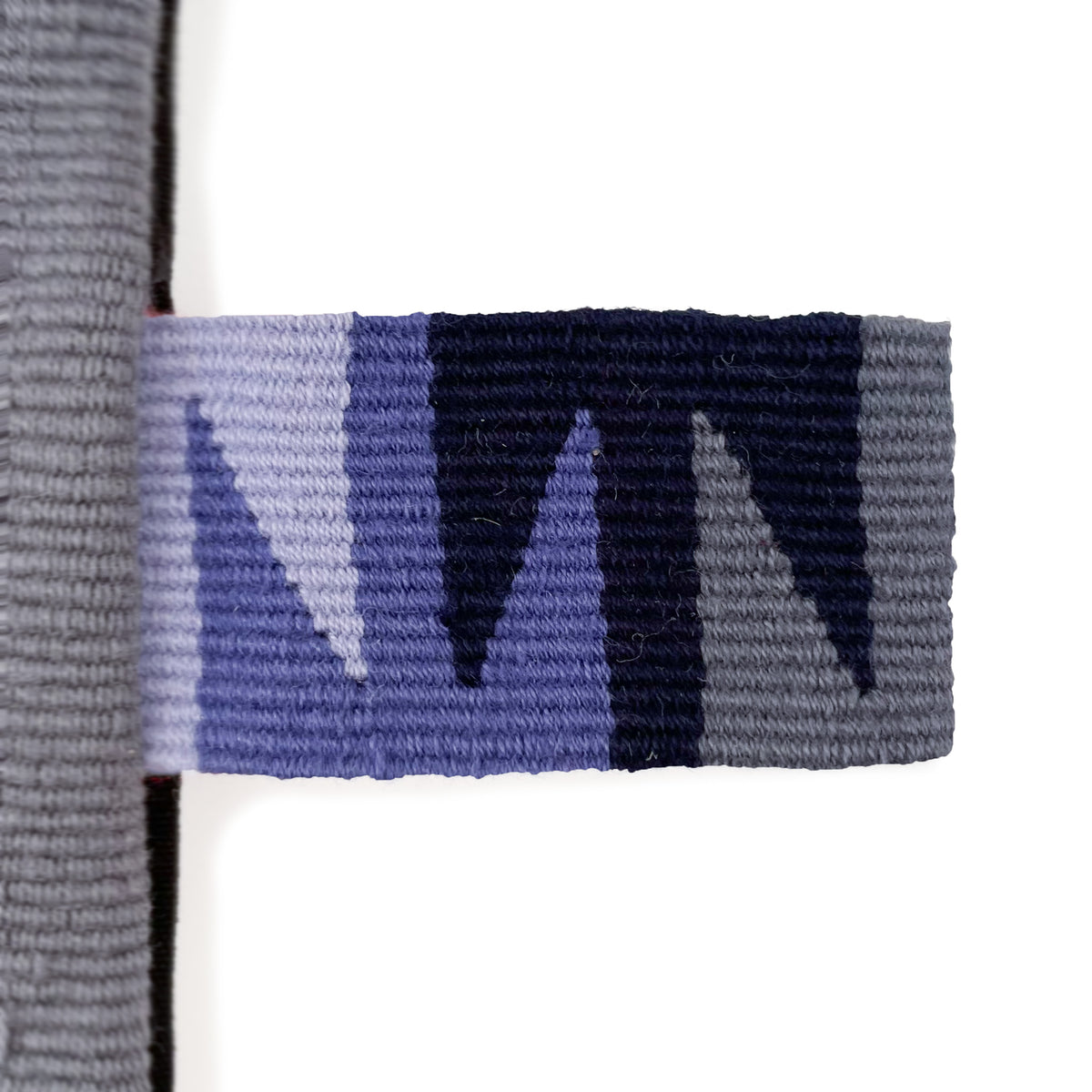 Closeup of cinta tag in blue and grey tones