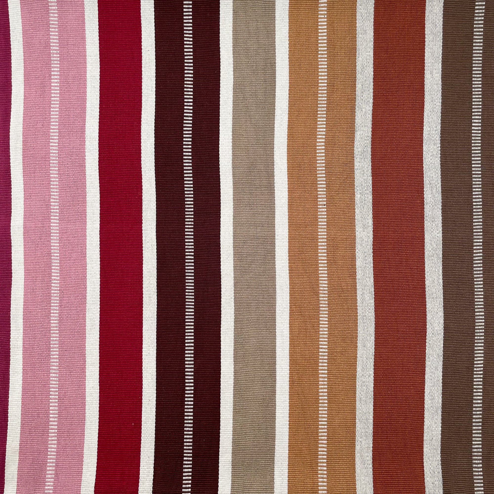 Front view of cushion with colorful stripes grading from pink to red to shades of brown, with colorful cinta tag