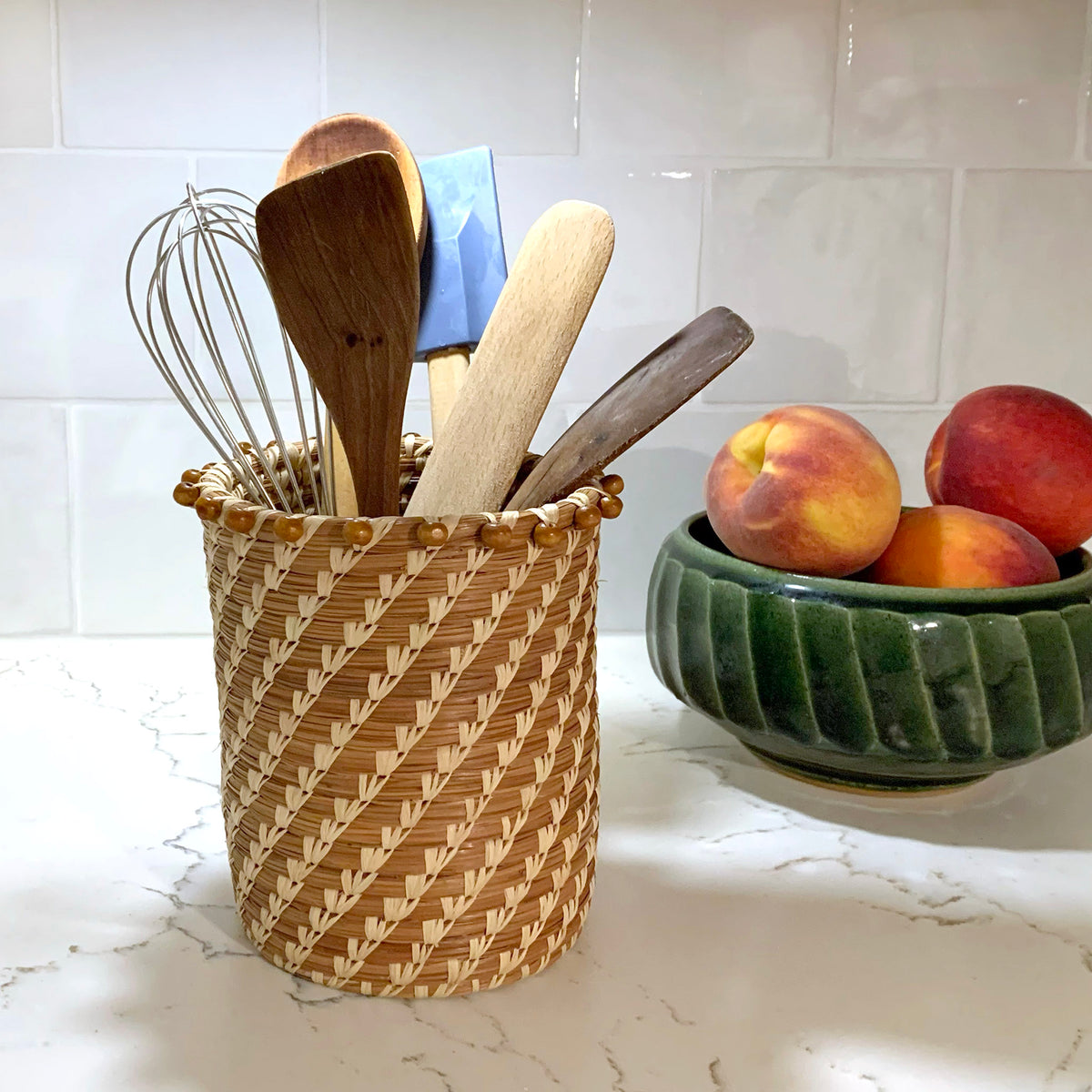 pine needle basket with kitchen utensils