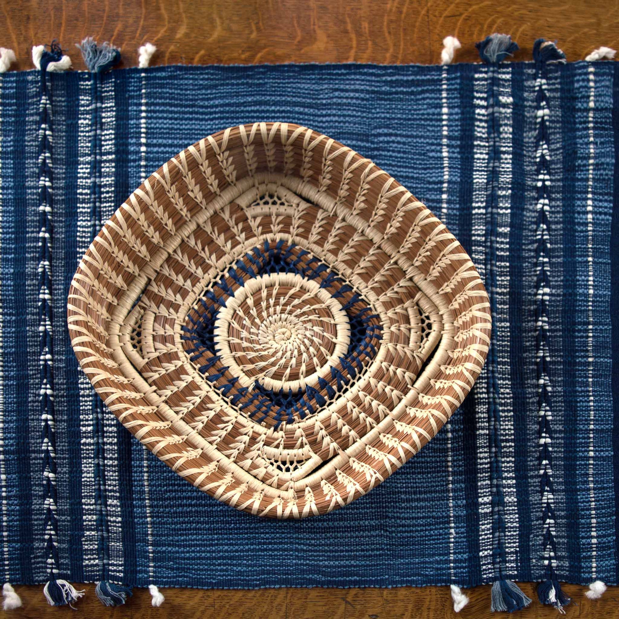 handwoven indigo arrow pattern table runner with twisted fringe