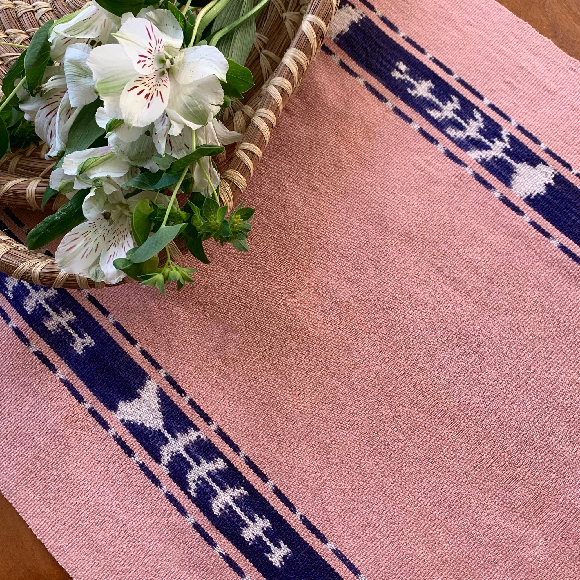 handwoven table runner blush with indigo ikat stripe