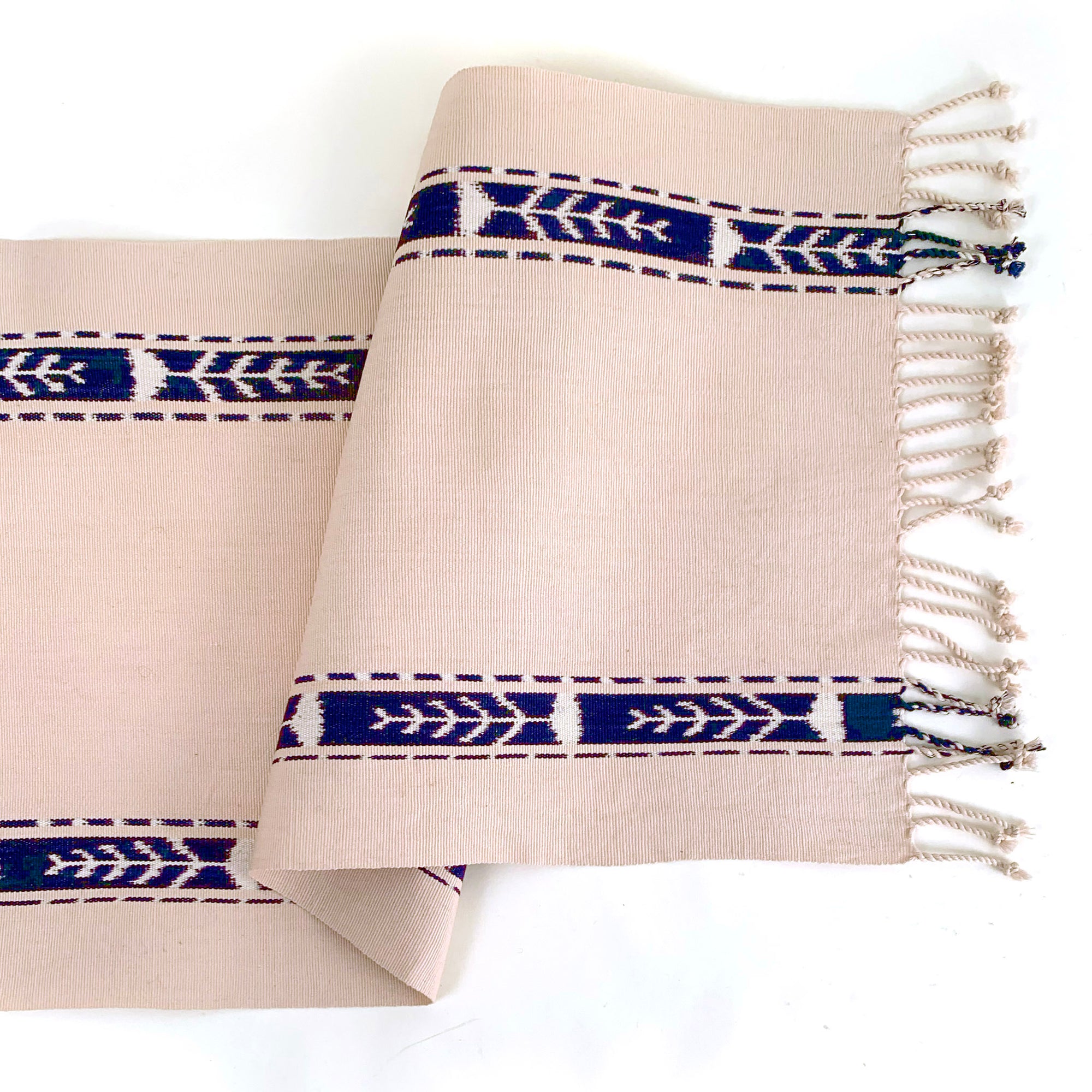 handwoven table runner beige with indigo ikat stripes on side