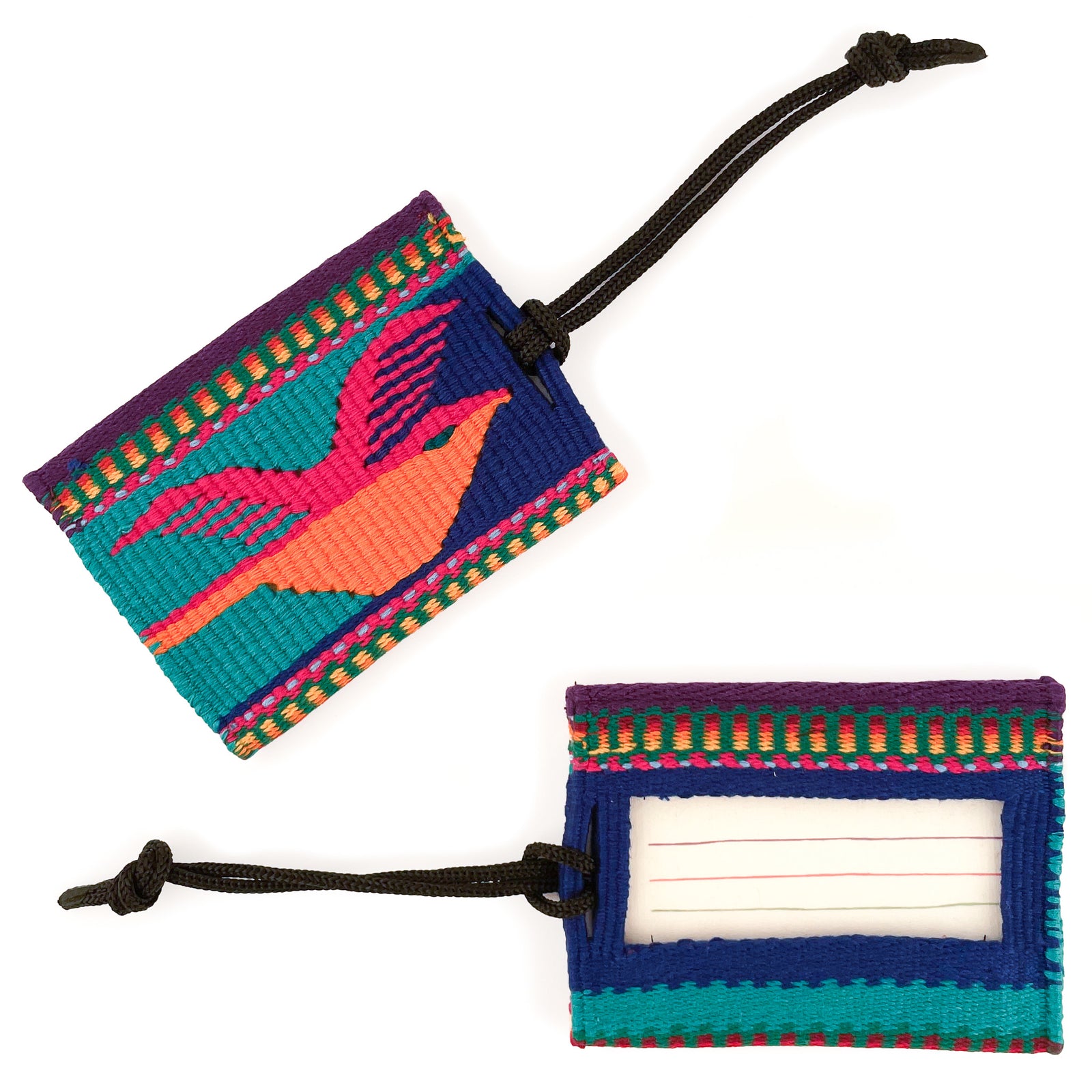 Overhead view of tapestry woven luggage tag, featuring bird motif in magenta and orange on teal and blue background on front, and ID card window on back