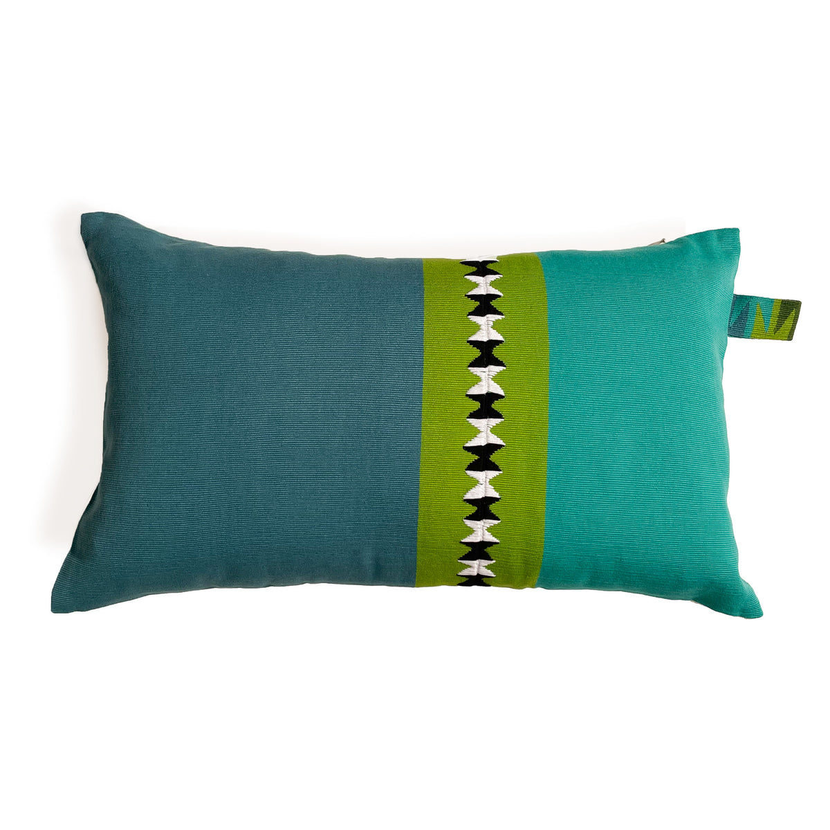 Front of rectangular cushion with color block panels in turquoise, green with black and white randa detail, and teal, with colorful cinta tag