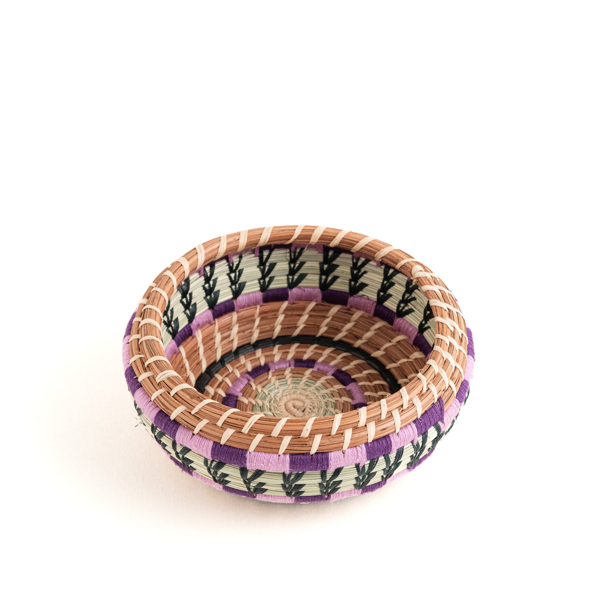 small pine needle basket with colorful yarn side view