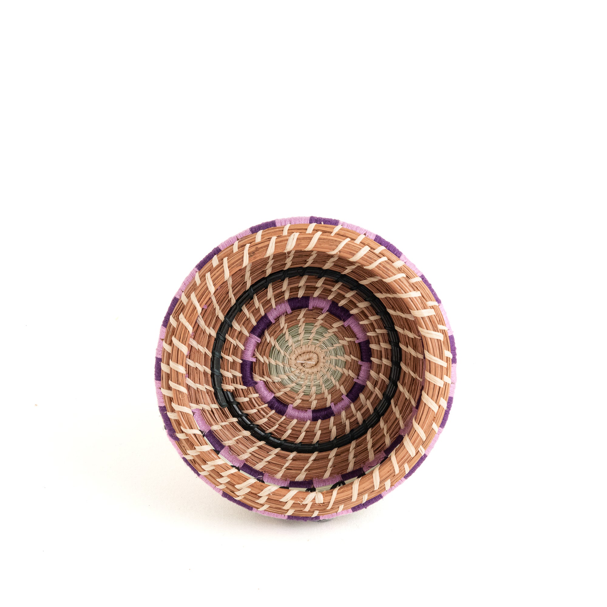 small pine needle basket with colorful yarn side view