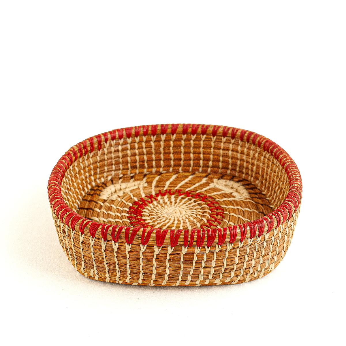 pine needle basket with red and brown accents