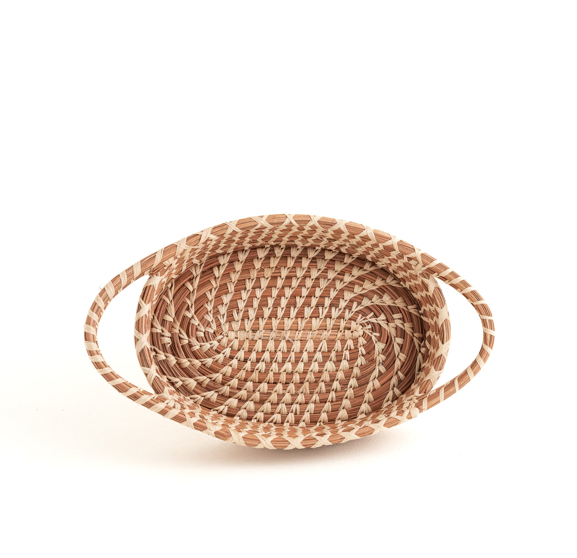 oval pine needle basket with handles, showing intricate stitches