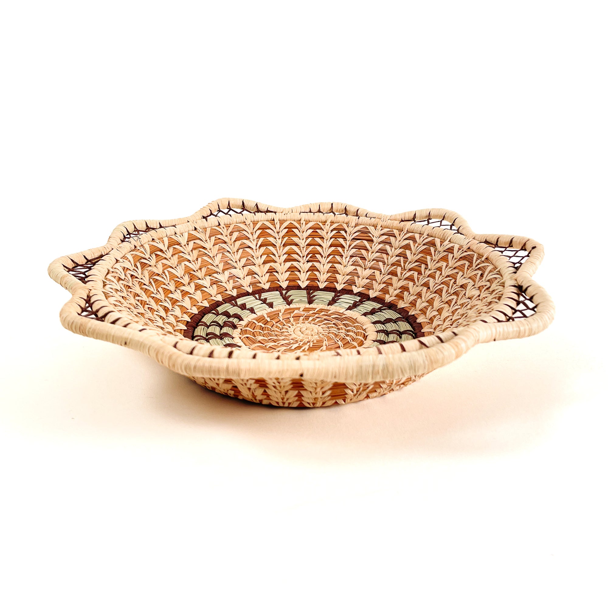 Pine needle handmade basket with traditional designs - top view