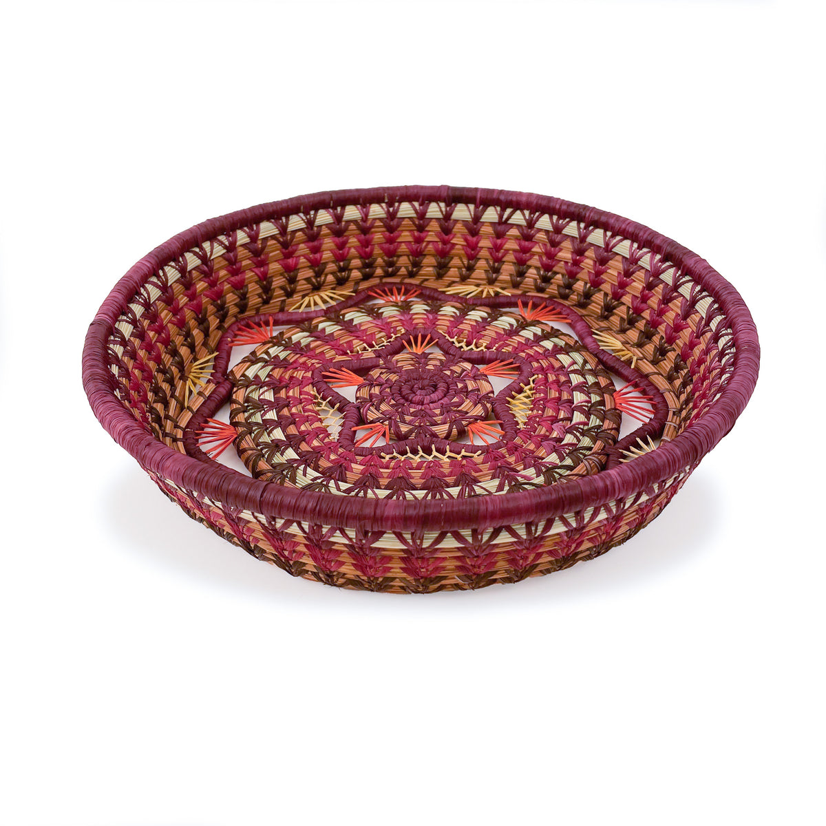 Angled view of Rosenda Basket in Wine, featuring a wine-color rim, scallop detail, and star-shaped accent in center, with raffia detailing
