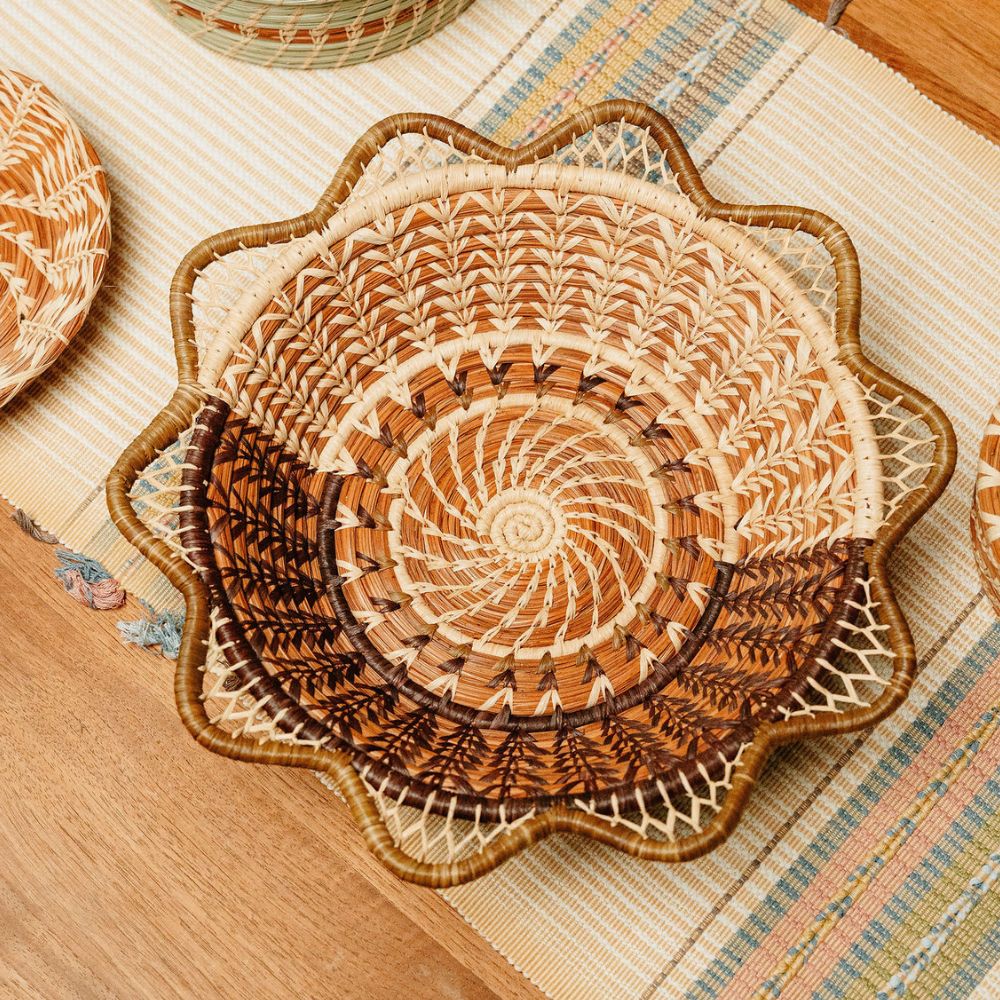 Cafe Basket, with scalloped edge and contrasting raffia stitching over table runner on wooden table.