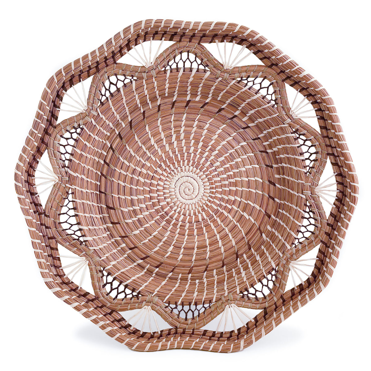 Front facing view of woven pine needle Andrea Basket, with scalloped pattern and geometric rim, on white background