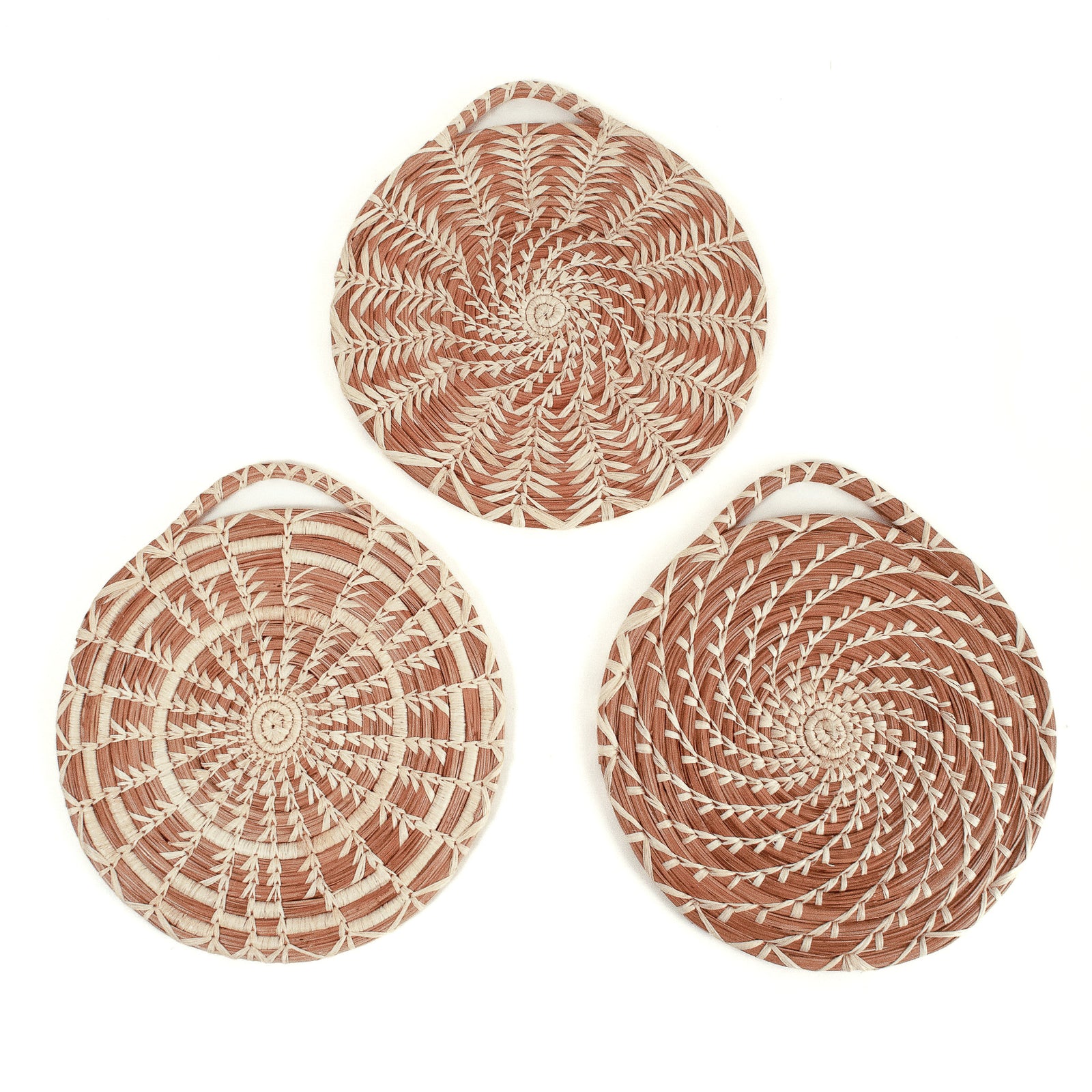 Group of three hanging pine needle trivets