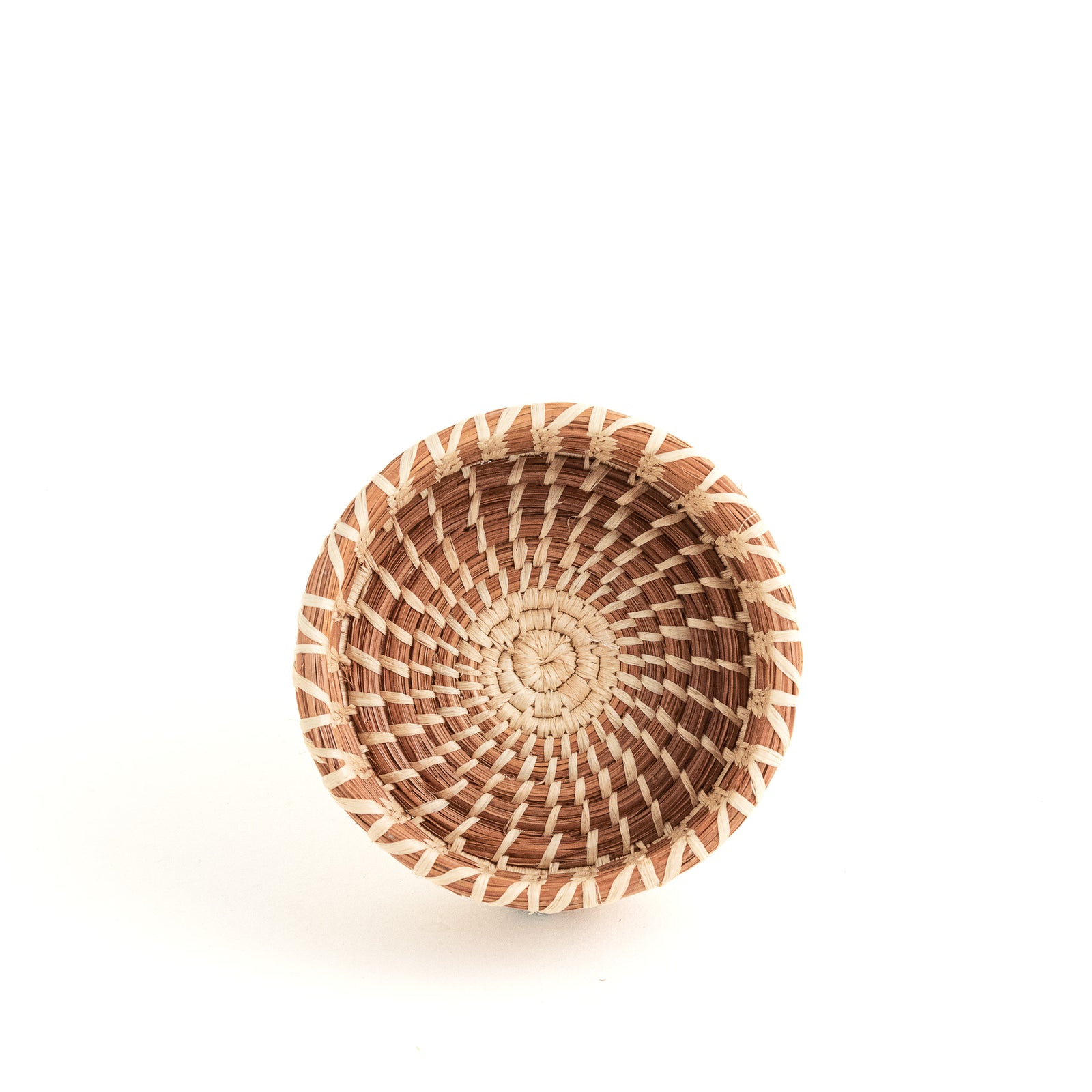 small round pine needle basket with straight sides and decorative stitching