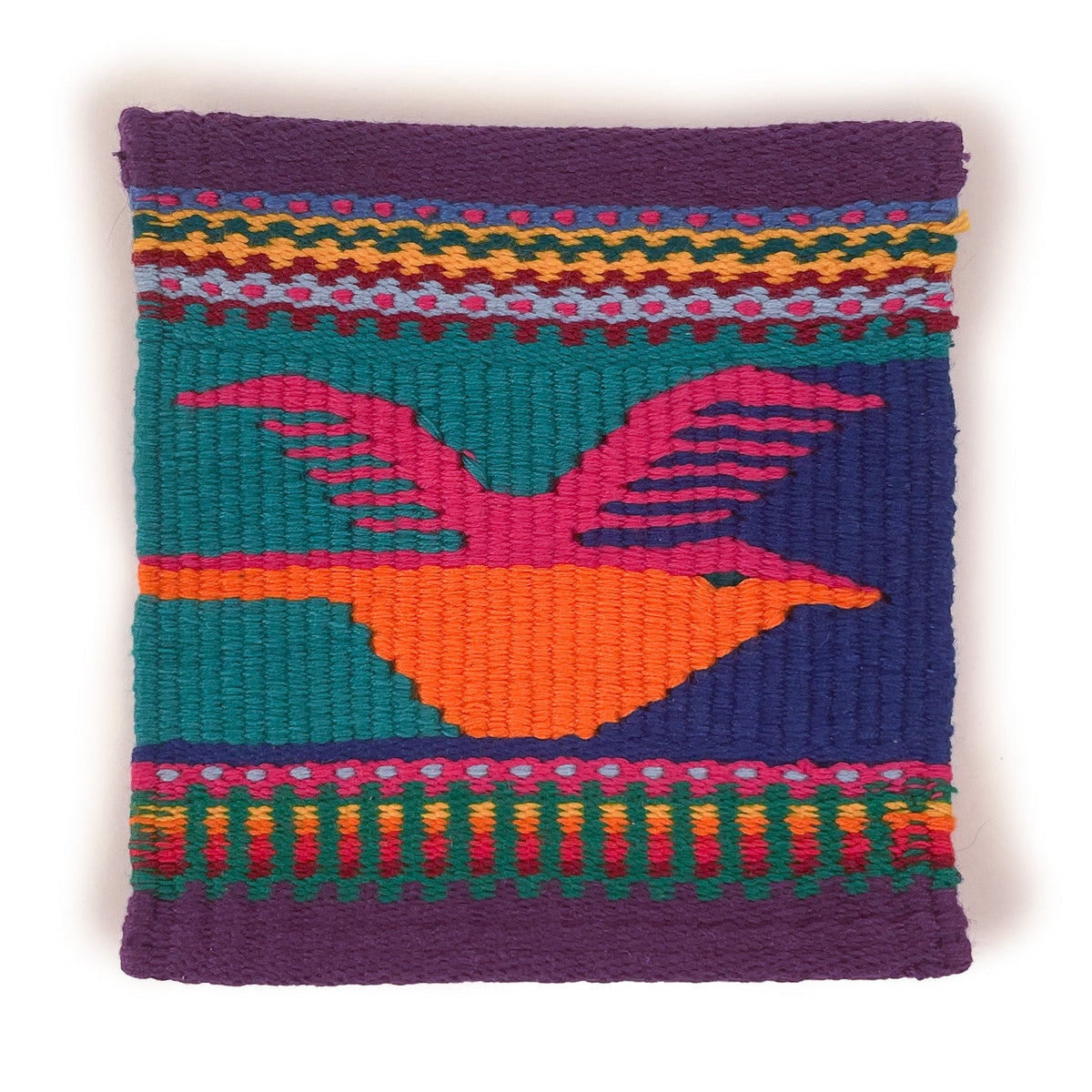 Tapestry woven coaster, featuring a bird in pink and orange on a multicolor background of teal and deep blue, with purple border and multicolor striped details