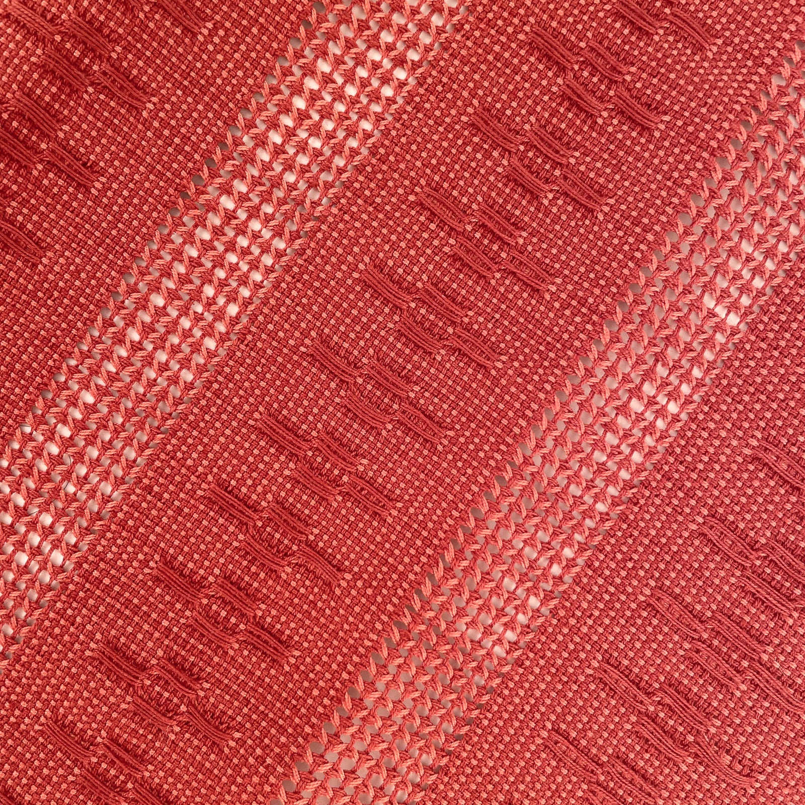Overhead view of the Calado Table Runner in Terracotta with twisted fringe