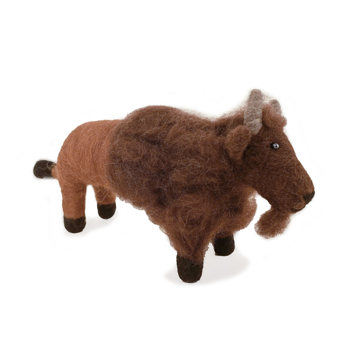 Side view of felted wool buffalo ornament on white background