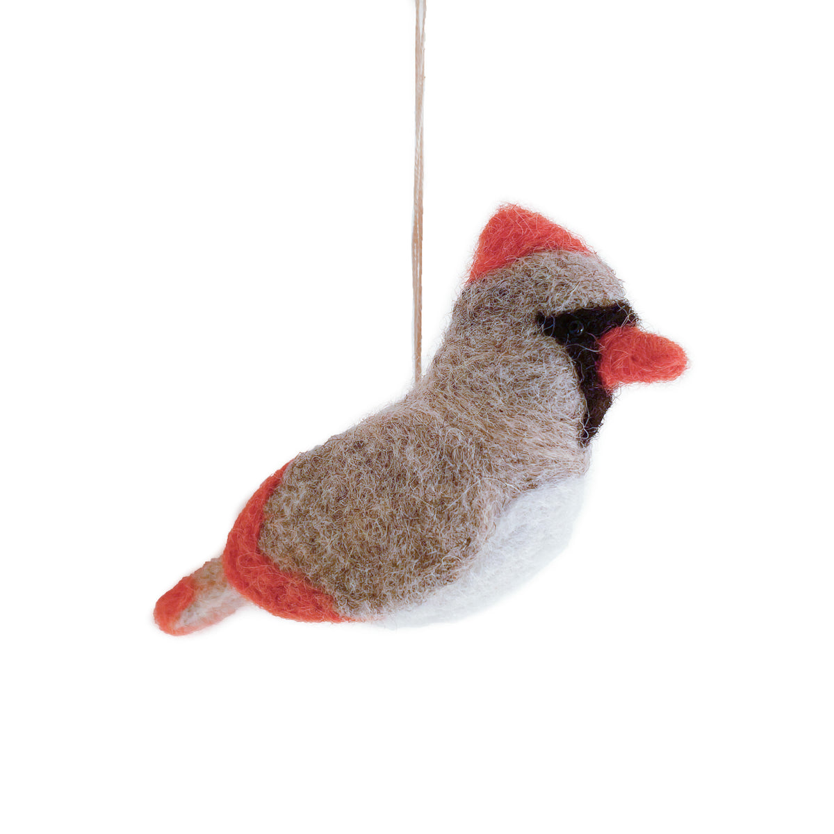 A felted wool female cardinal ornament, with beige grey body, red crest and tail, white belly, and black eye patch, hanging from a thin string against a white background.
