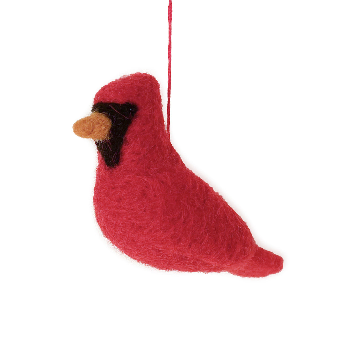 A red felt bird ornament, likely a cardinal, with a black face patch and a tan beak, hanging by a red string against a plain white background.