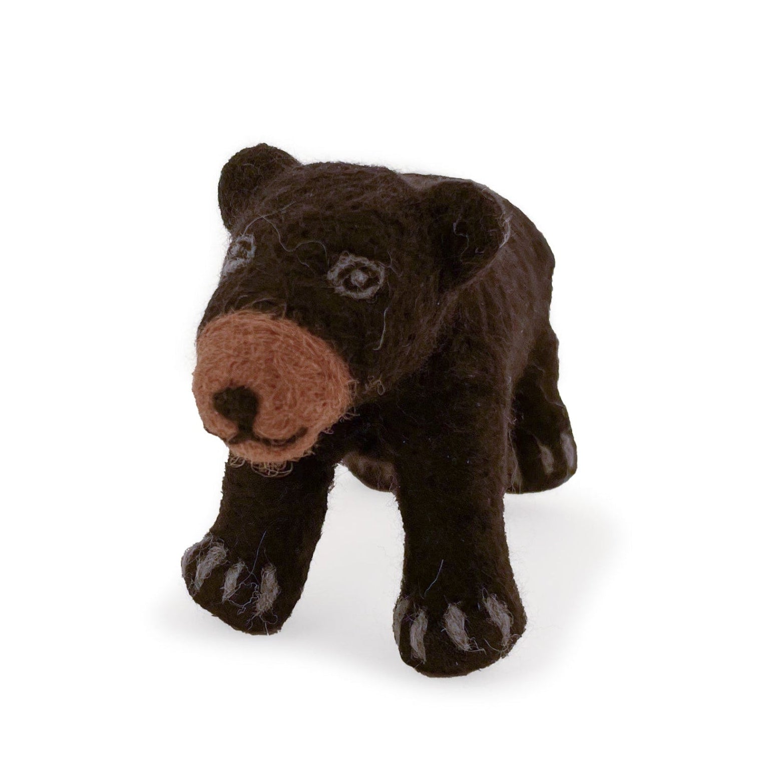 Angled view of felted wool black bear figurine on white background