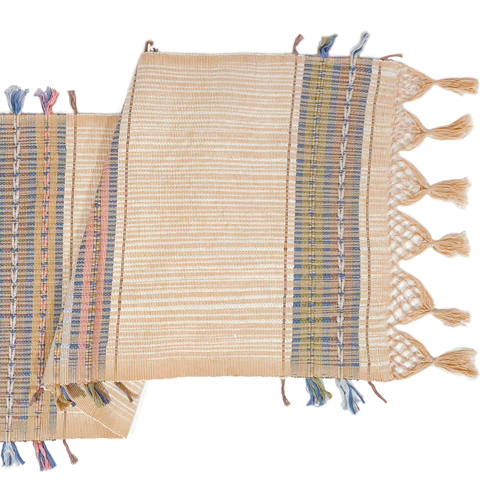 A woven textile ttable runner in beige with textured stripes in blue, yellow, and pink, finished with intricate mesh tassels on a white background.