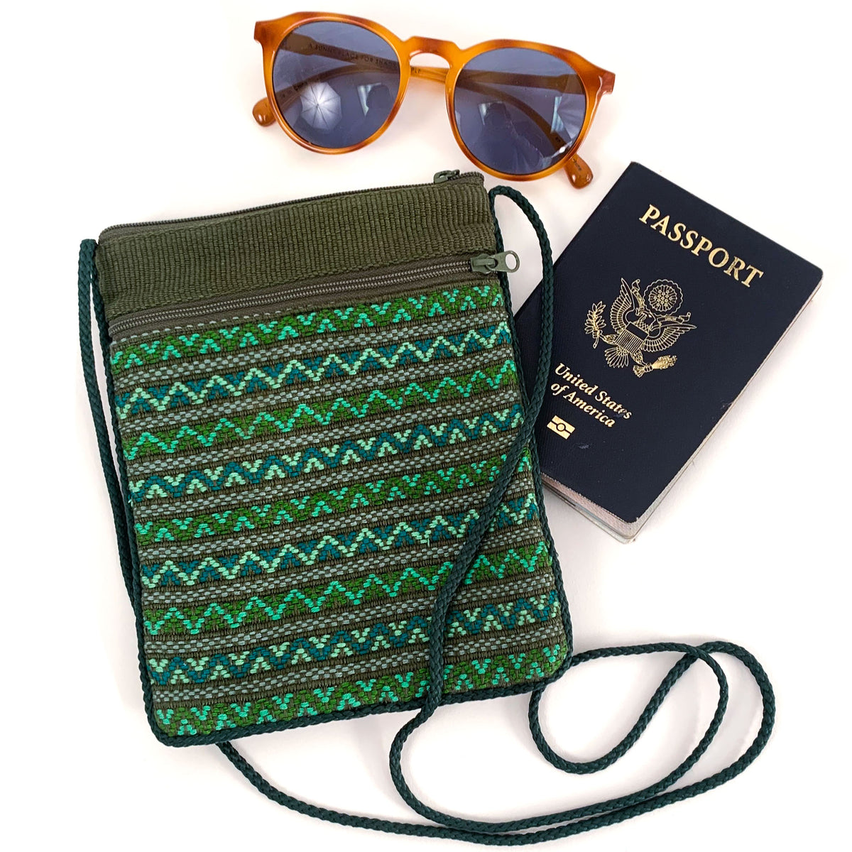 handwoven brocade pocket bag with passport and sunglasses