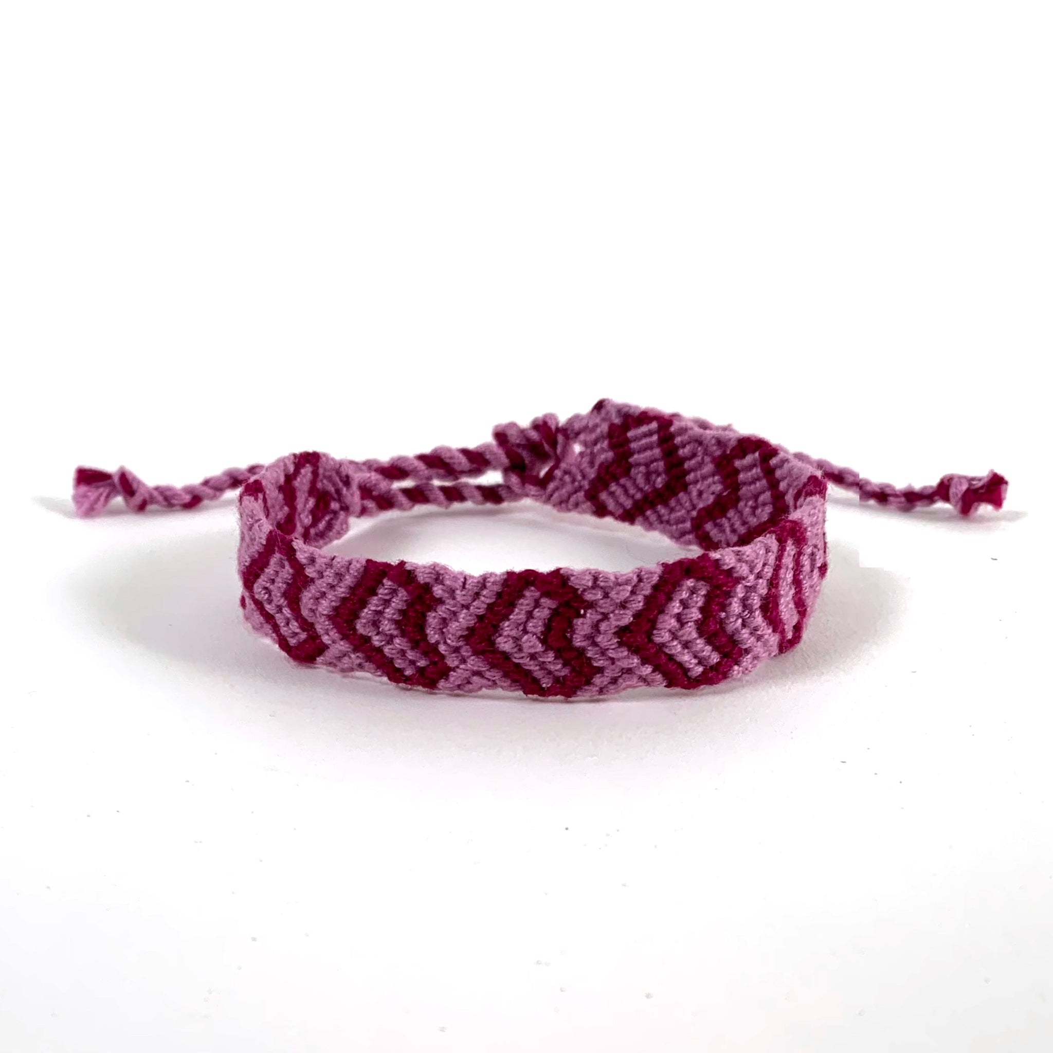 Vector rainbow lgbt handmade hippie heart friendship bracelet of threads.  4676858 Vector Art at Vecteezy