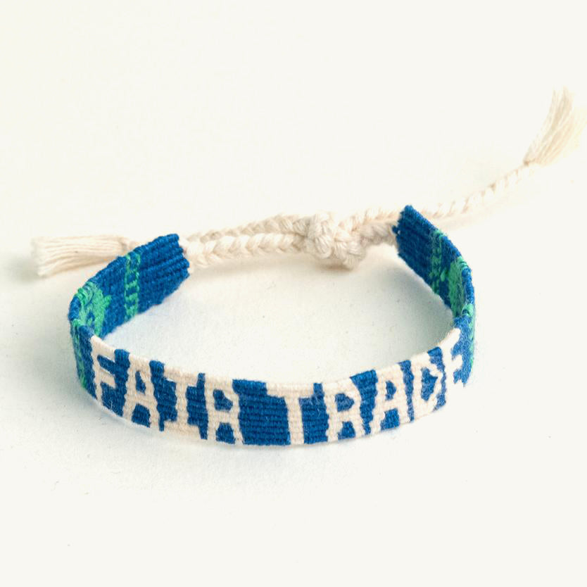 Friendship bracelet reads &quot;fair trade&quot;