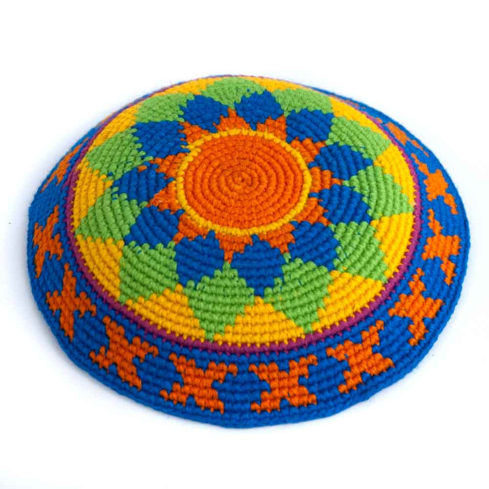 Crochet kippah with starburst center and patterned border, in orange, blue, and green