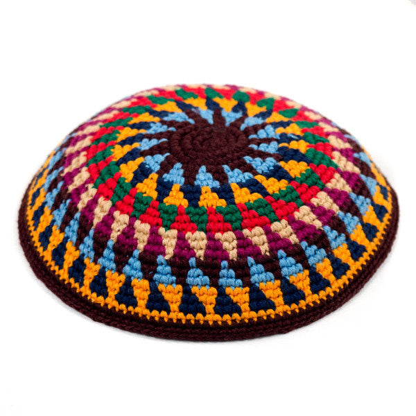 Crochet kippah in browns, reds, and yellows with blue and green accents