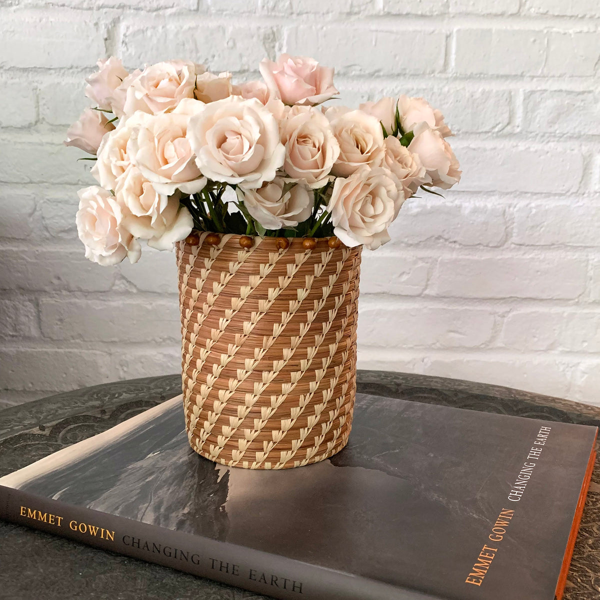 pine needle basket with white roses