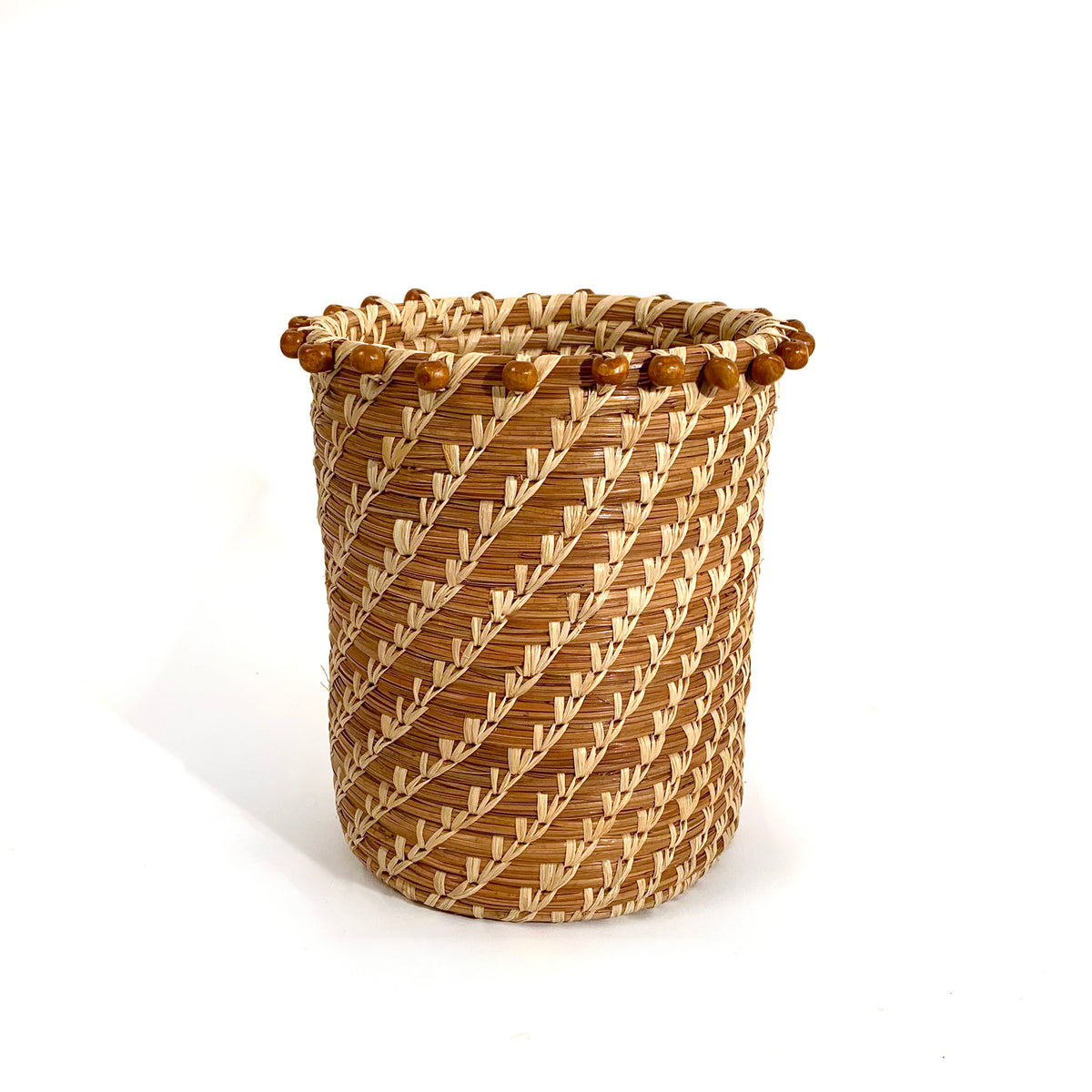 tall pine needle basket with wood beads at rim