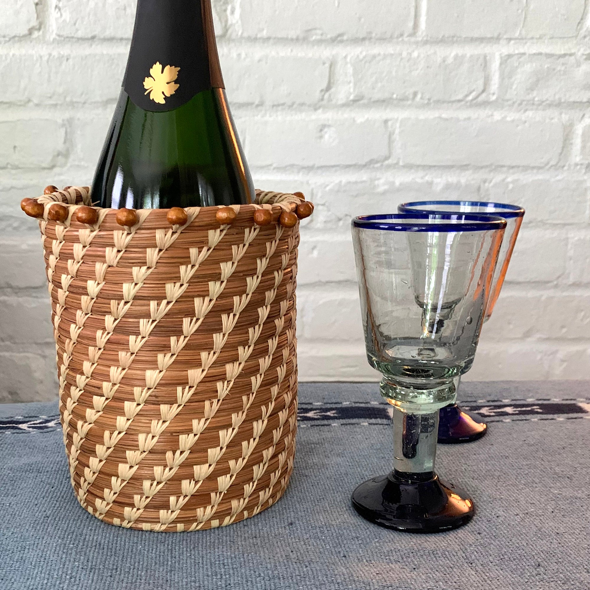 tall pine needle basket with wood beads at rim