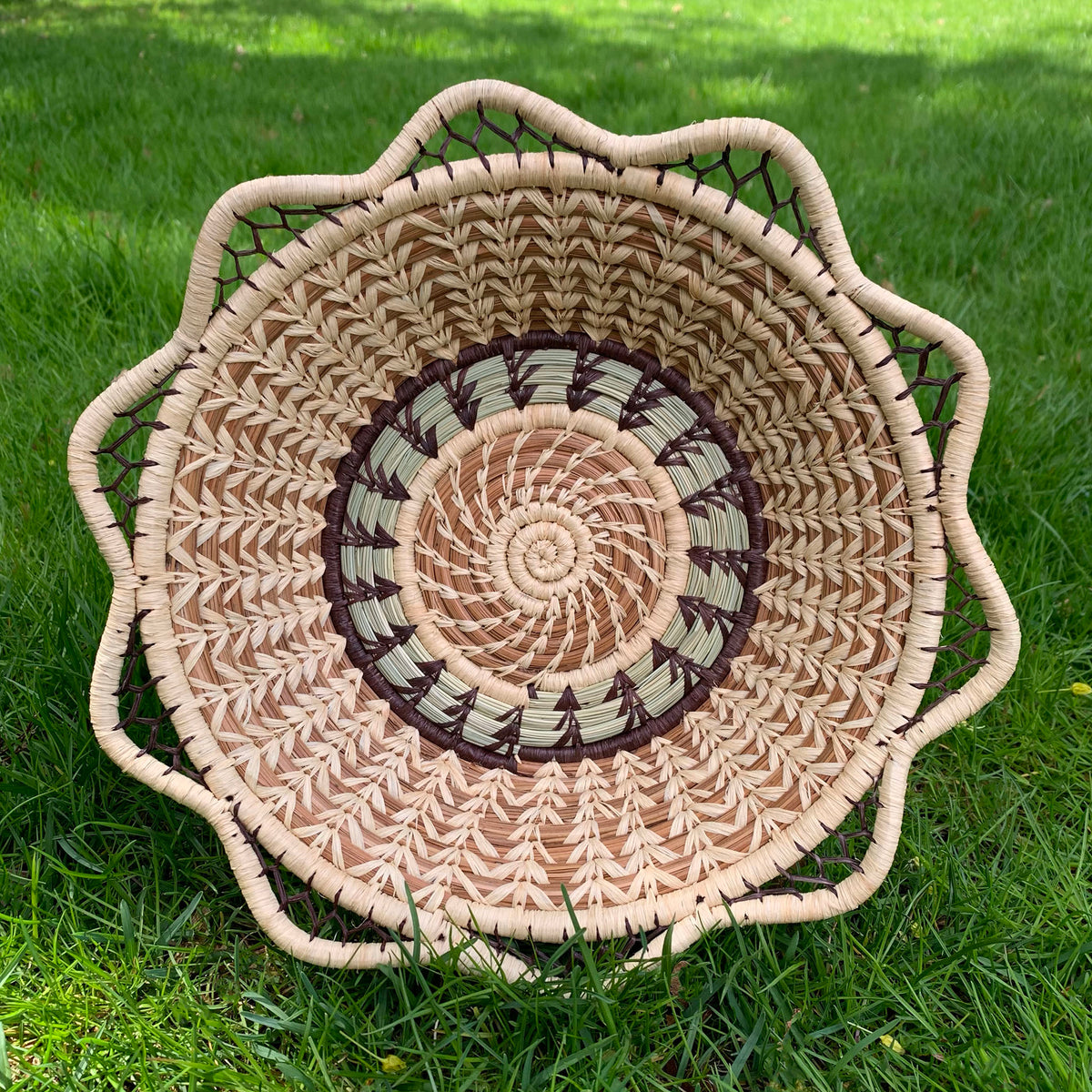 Pine needle handmade basket with traditional designs