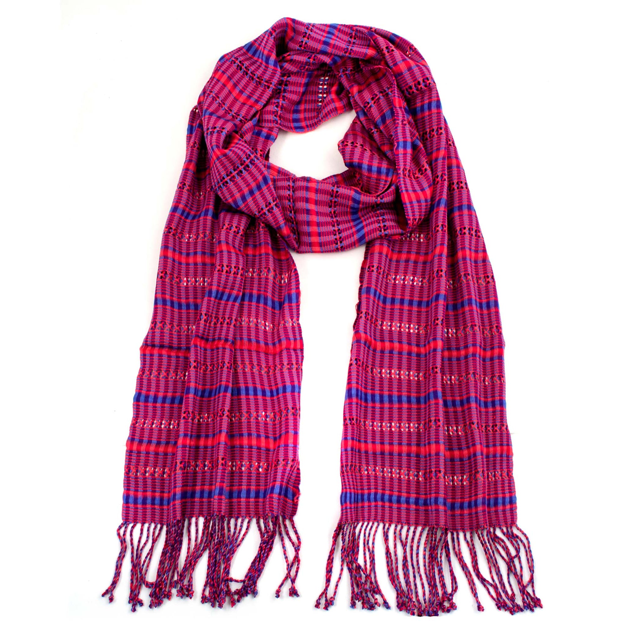 Annabelle Scarf in Fuchsia, made from rayon threads in pinks and blue, with twisted fringe. The scarf is laid flat, wrapped with a circle on white background.