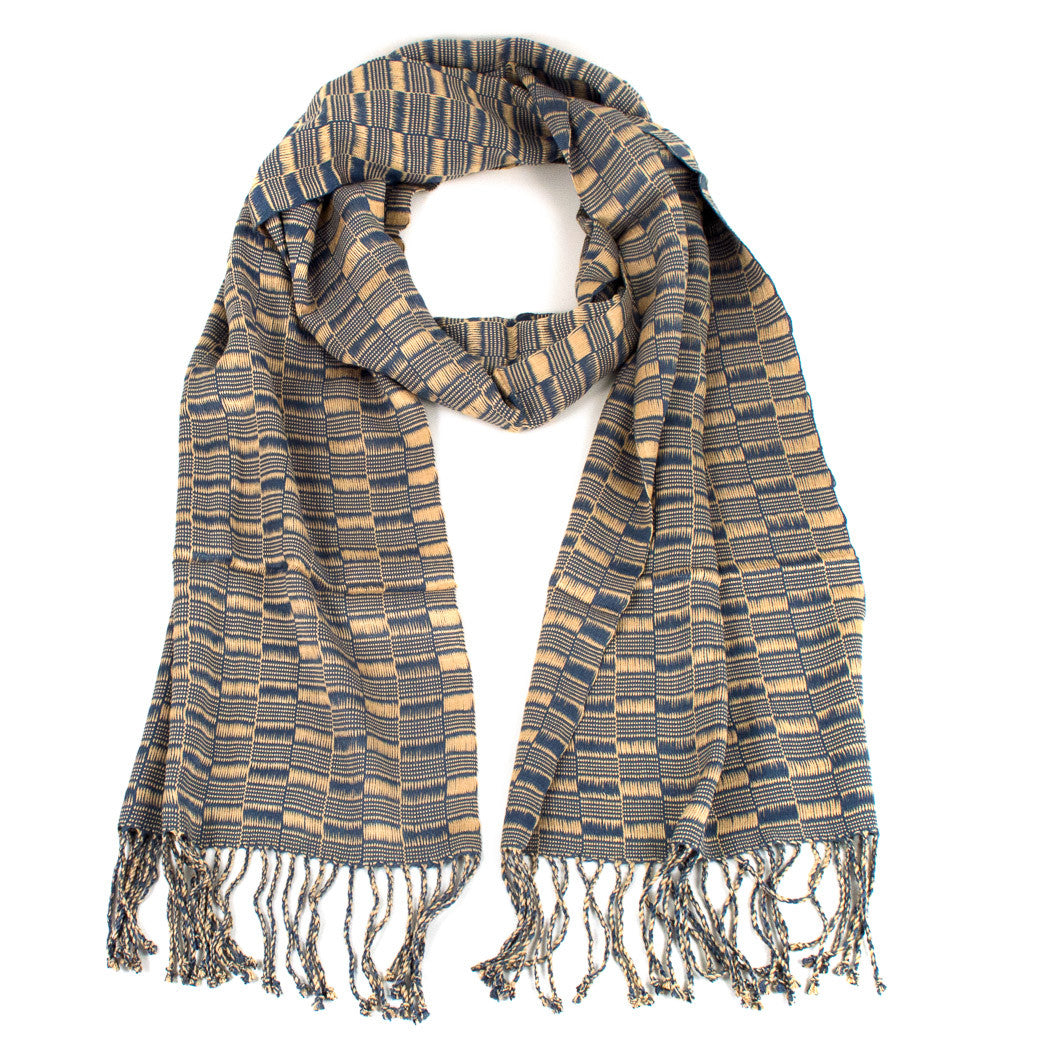 Elsa Scarf in Slate Blue & Oat, made from rayon threads in gray blue and beige tones, with twisted fringe. The scarf is laid flat, wrapped with a circle on white background.