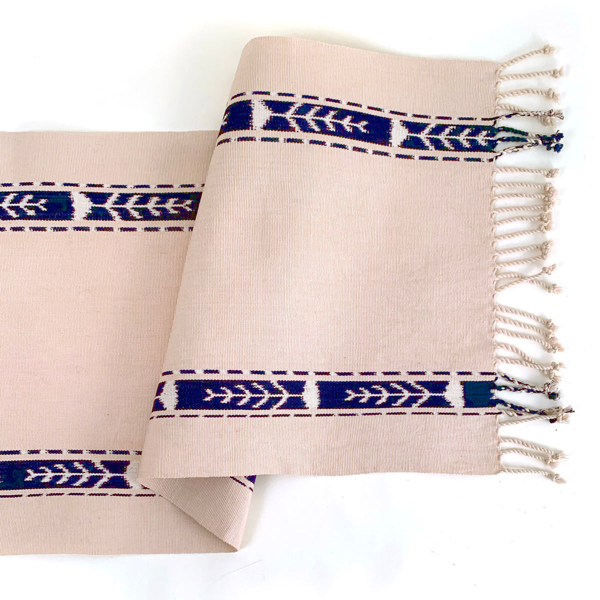 handwoven table runner beige with indigo ikat stripes on side